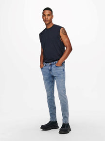 Jeans delgados de la vida de telar - mezclilla azul